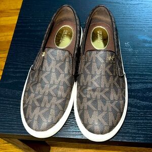 MK brown logo slips ons